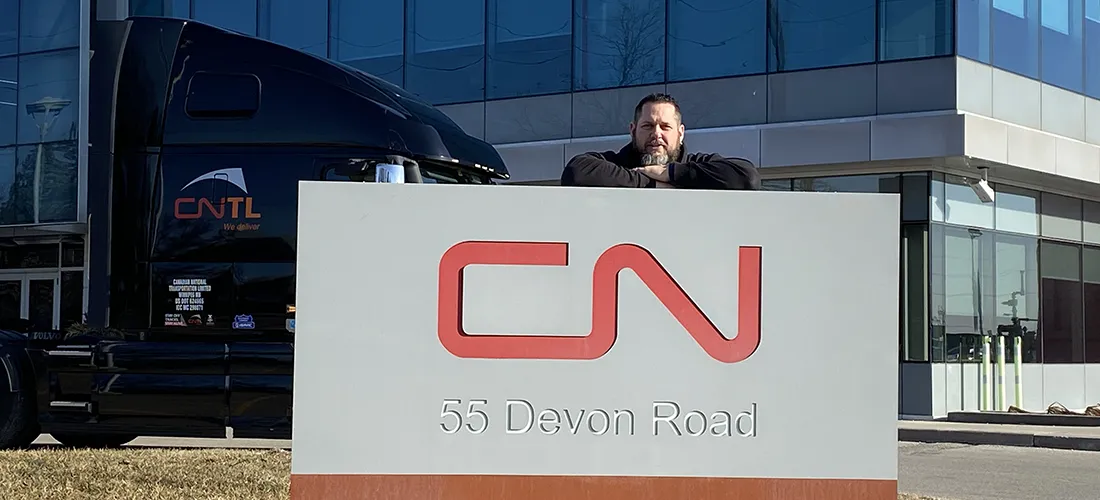 Chris Tinkler with CN sign