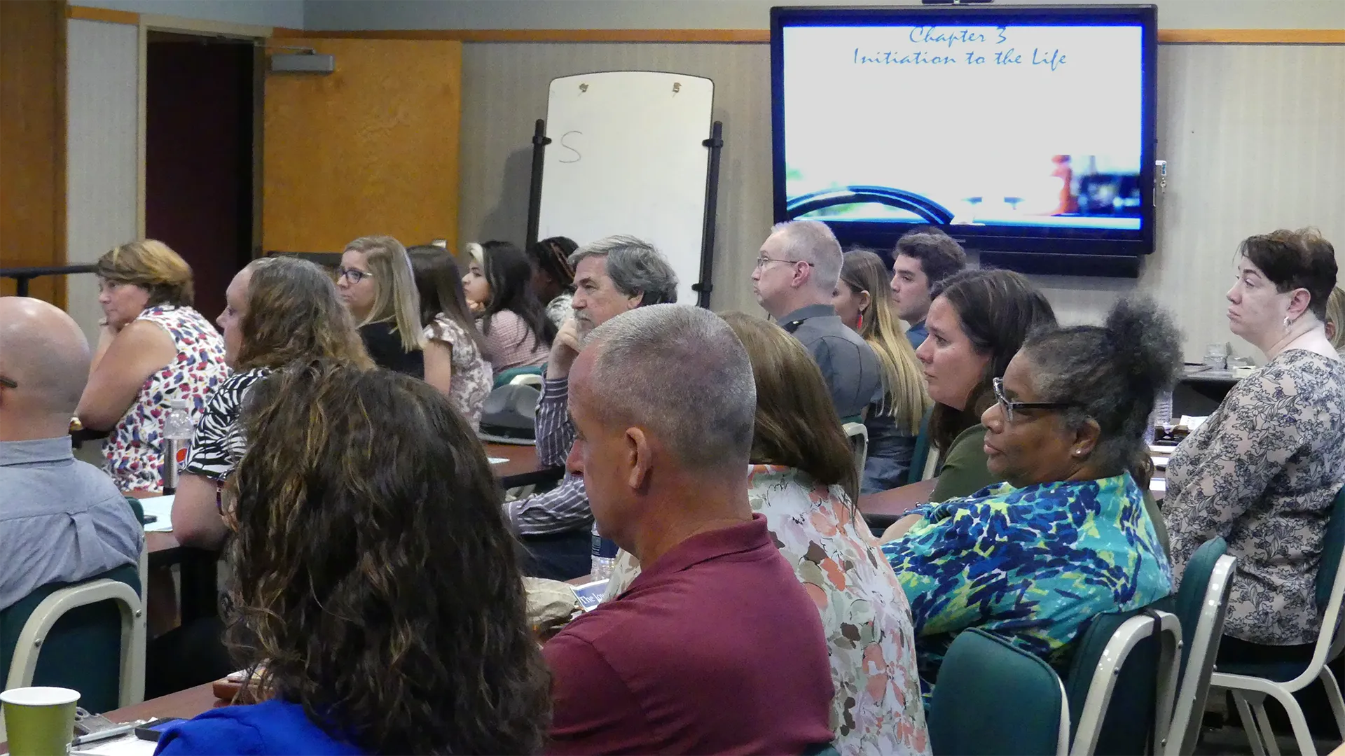 People listen at a Coalition Build