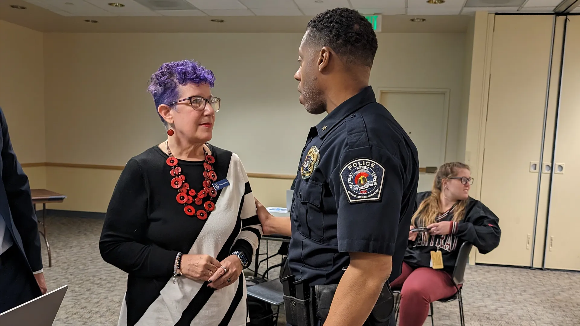 Kelley Alsobrook and officer at a Coalition Build