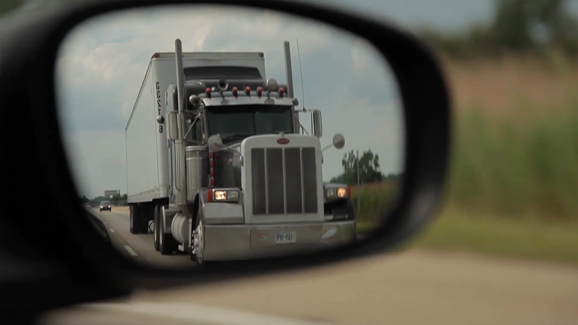 Truck in side mirror